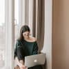 Young busy woman working from home in sweatpants
