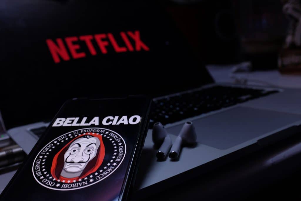 The money heist logo next to the Netflix logo