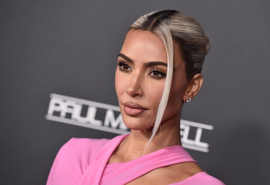 Kim Kardashian posing on a red carpet