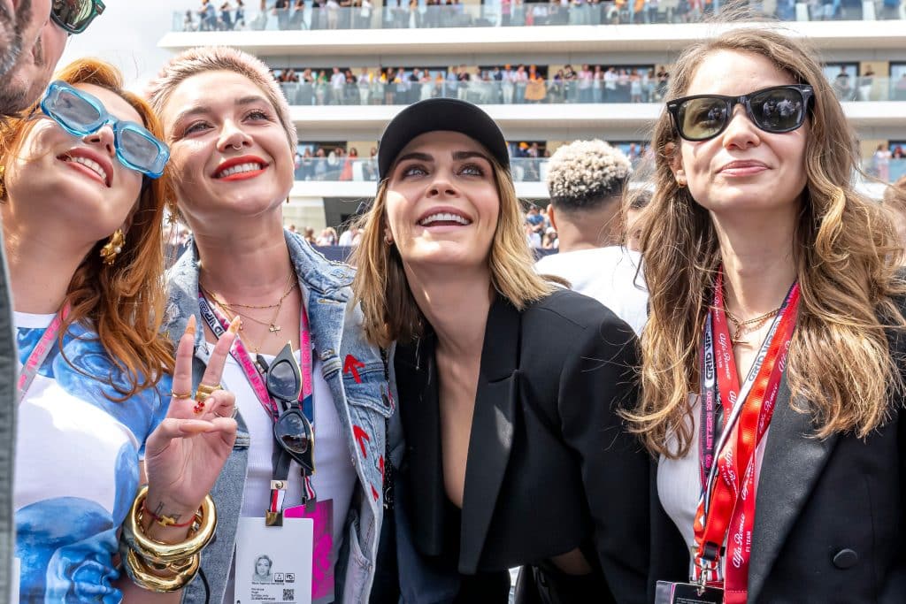 Florence Pugh and Cara Delevingne in side the F1 Paddock at Silverstone 2023 Grand Prix.