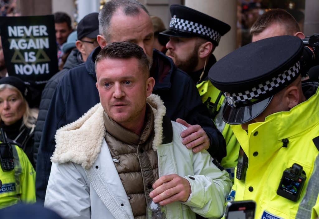 Tommy Robinson Being Escorted By Police Officers Last November