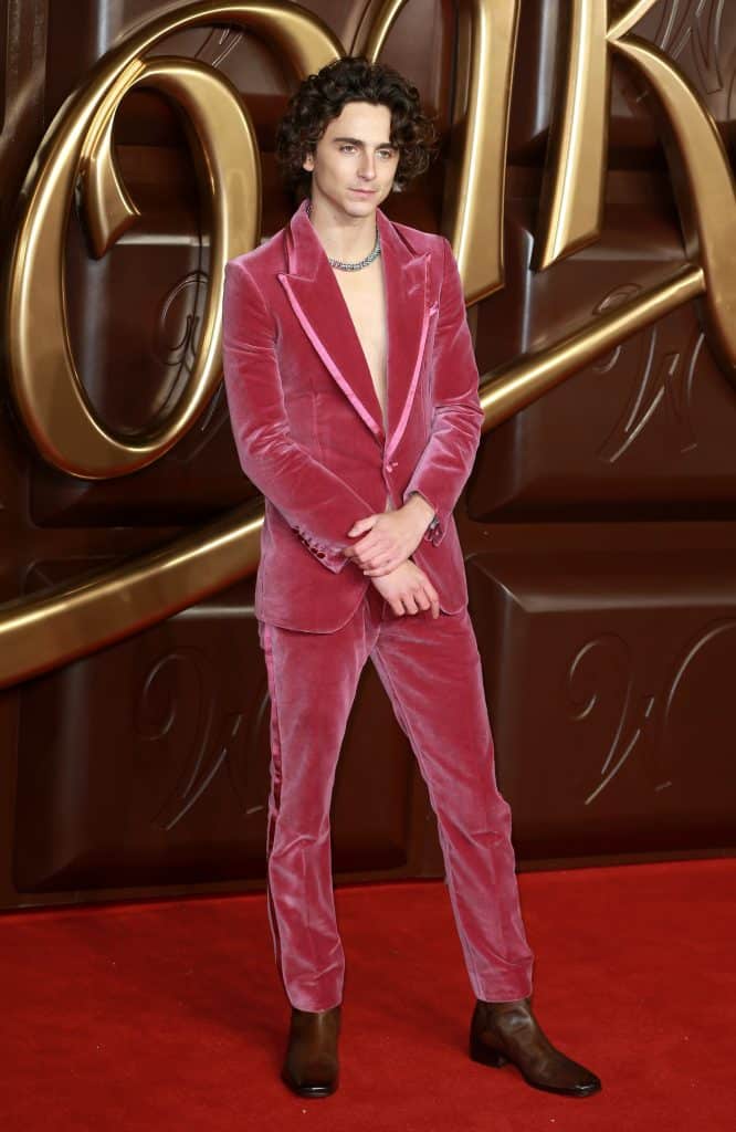 Timothee Chalamet in a mauve suit promoting Wonka