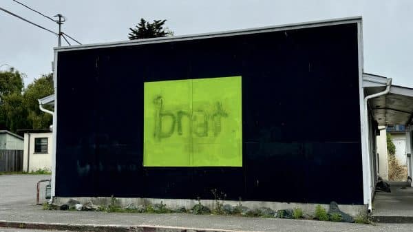 "Brat" album cover on a billboard.