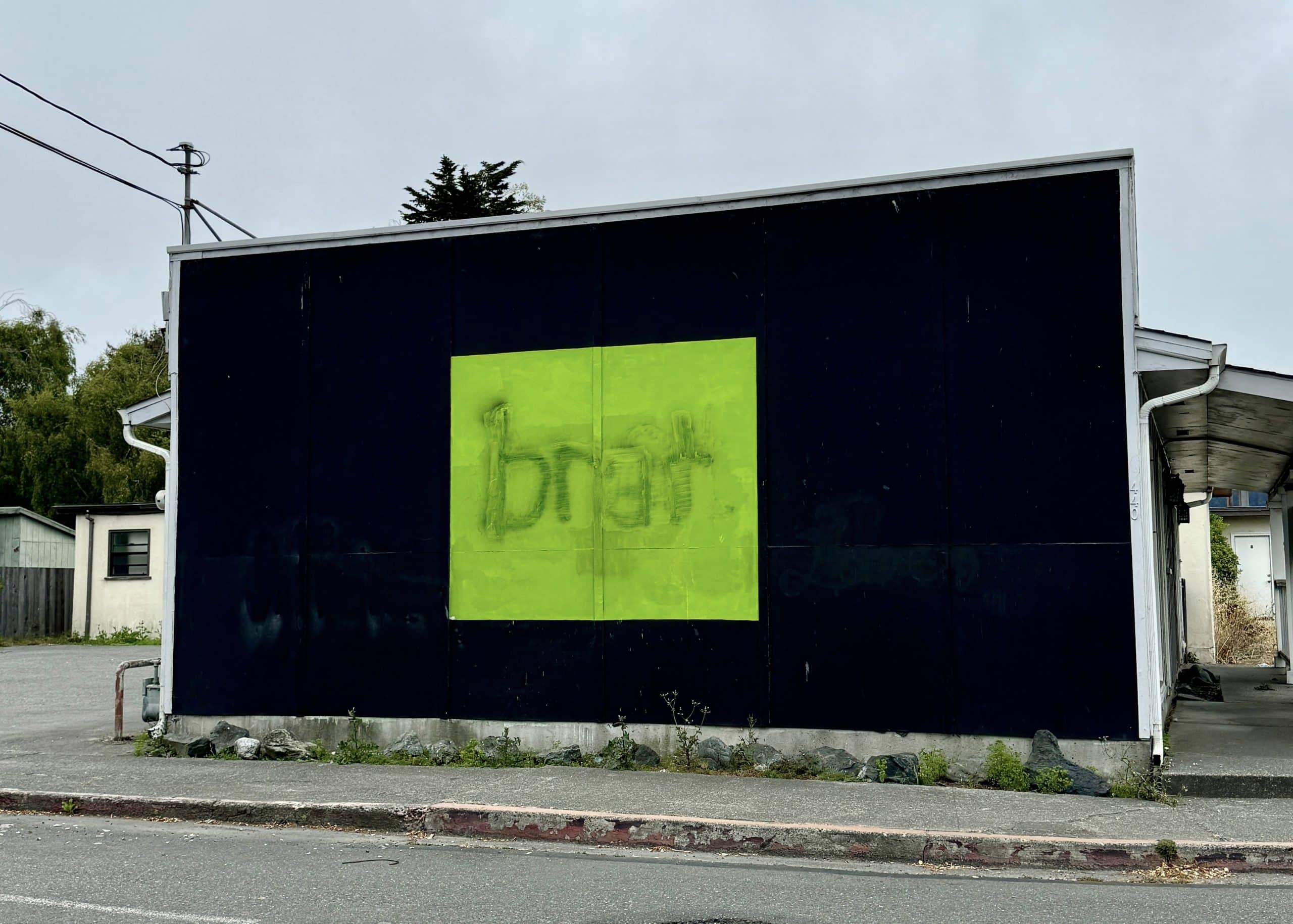 "Brat" album cover on a billboard.