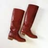 red frye boots displayed lying down