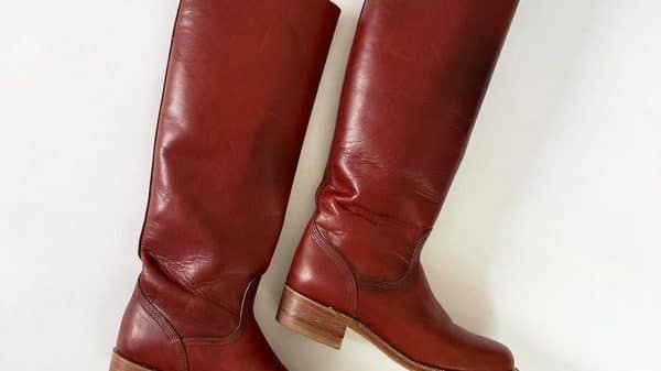 red frye boots displayed lying down