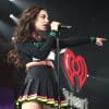 charli xcx singing into a microphone
