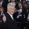 David Lynch at the 70th Anniversary Gala for Festival de Cannes. He is smiling and giving a thumbs up.