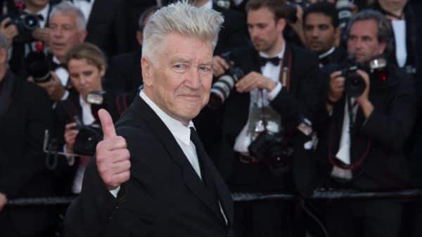 David Lynch at the 70th Anniversary Gala for Festival de Cannes. He is smiling and giving a thumbs up.