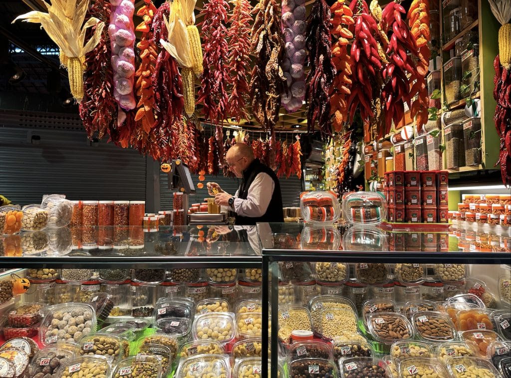 Colorful food shop with a man behind the counter