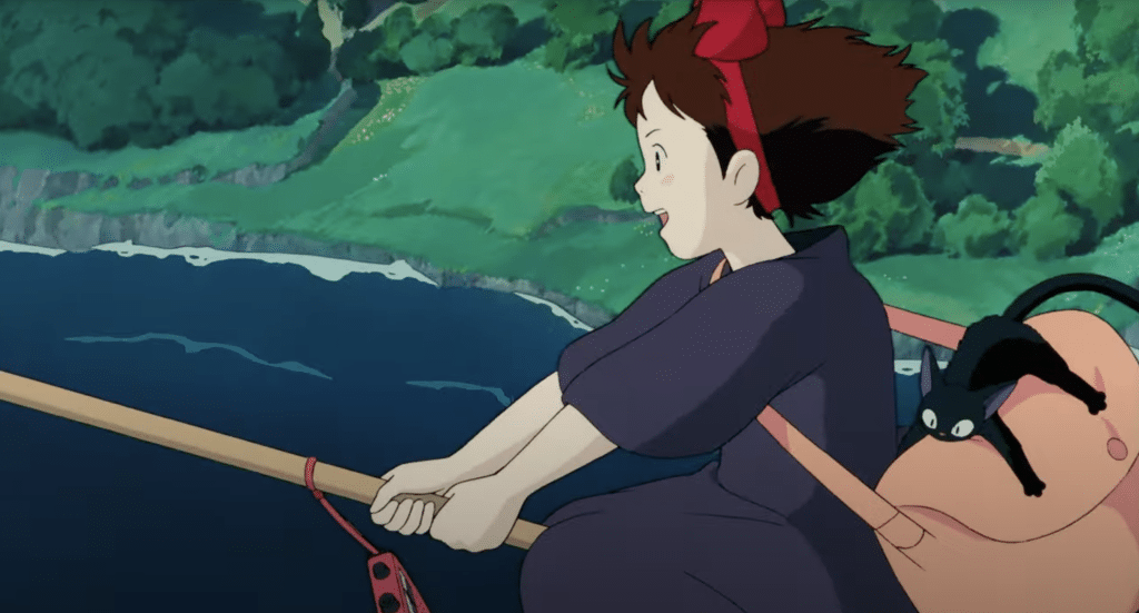 Female witch and her cat fly on a broom above the sea.