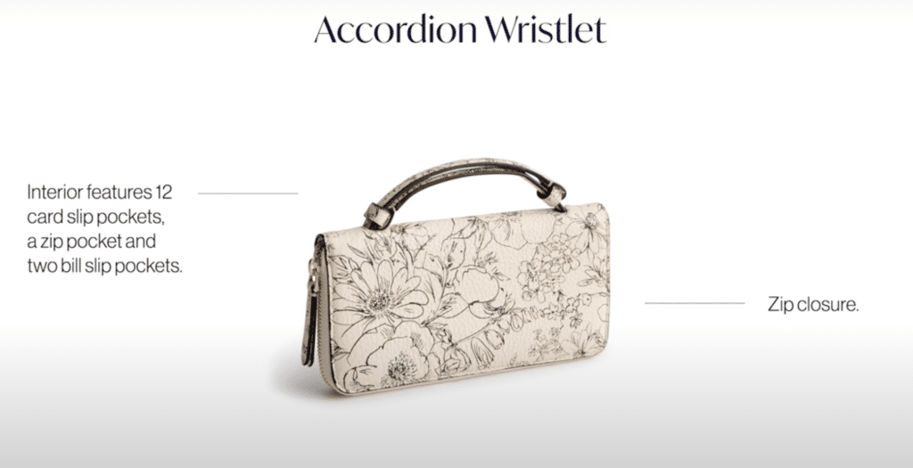 A cream Vera Bradley wallet with floral design, titled the accordion wallet