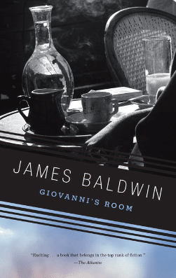Copy of Giovanni's Room by Jame's Baldwin. Cover shows a set table with a pitcher of water and cups, as well as a chair in the background