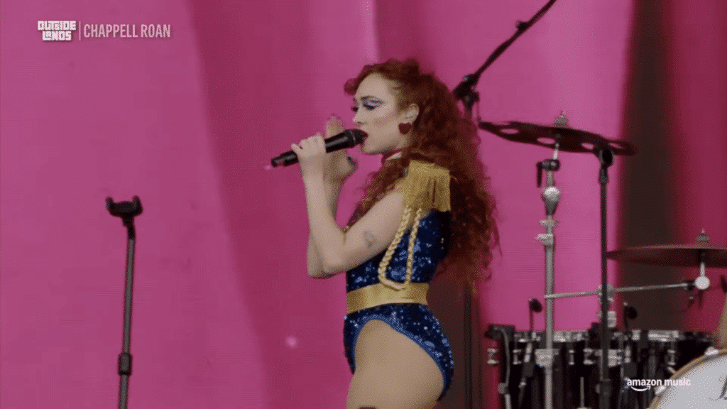 Chappell Roan stands in a blue leotard performing for the Outside Lands Music Festival.