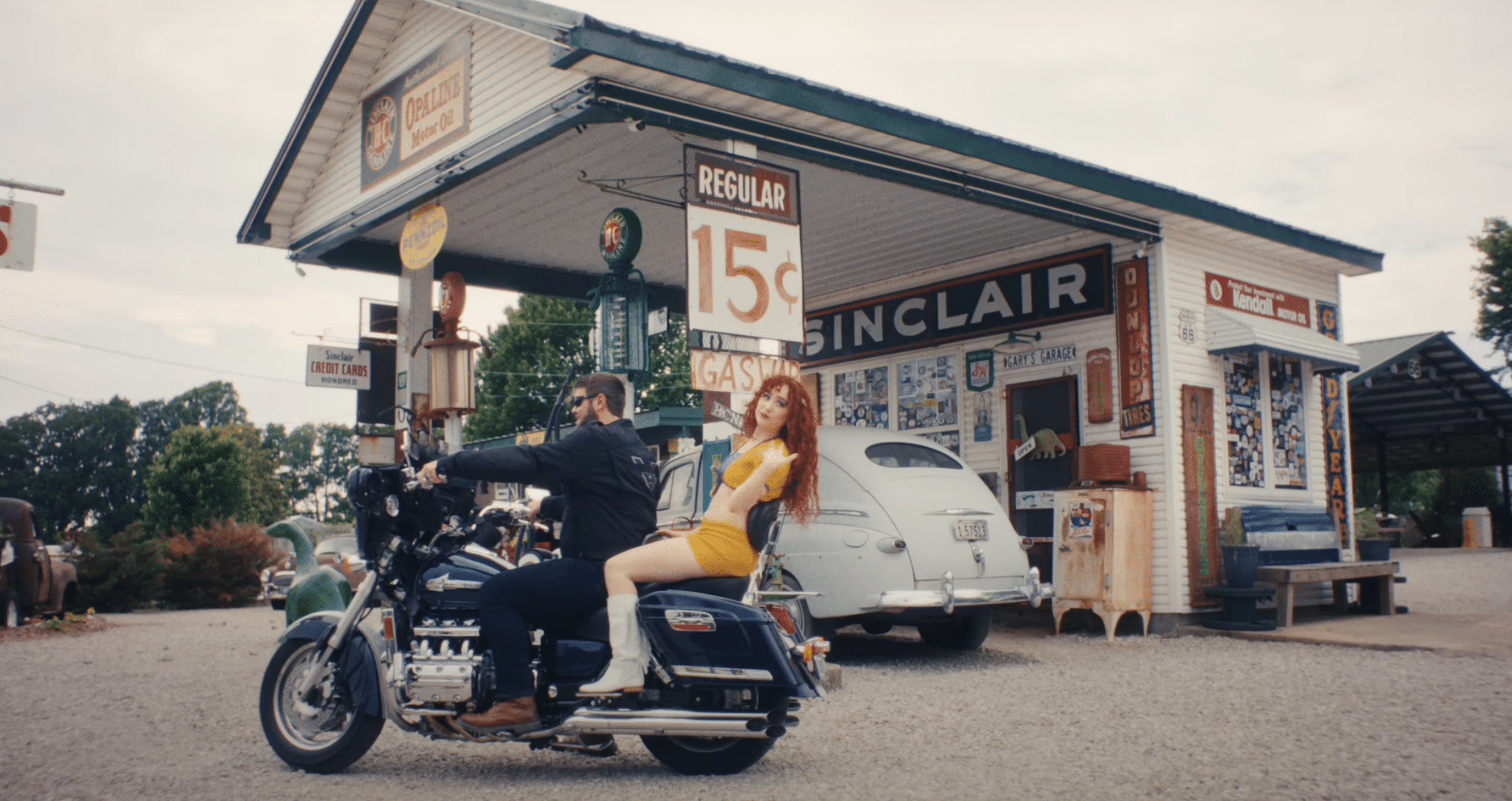 Chappell Roan on the back of a motorbike