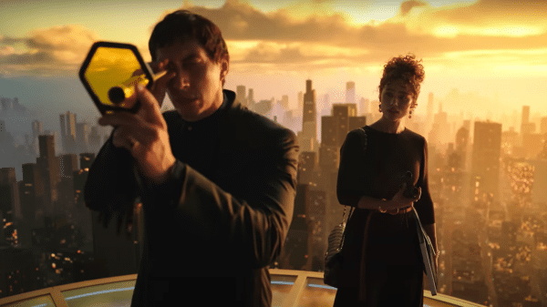 Cesar (Adam Driver) and Julia (Nathalie Emmanuel) overlook New Rome. Credit: YouTube/Lionsgate Movies