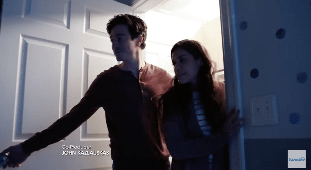 Amy and Jonah standing in a doorframe