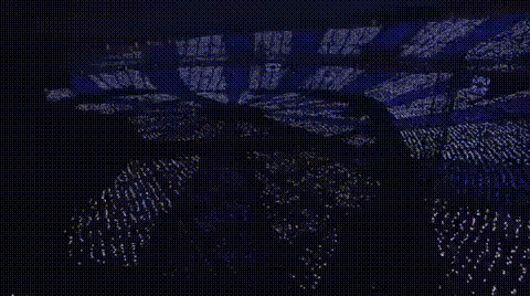 The penlights light up to cause the visual of a swirling pattern before lighting the stage Arashi stands on