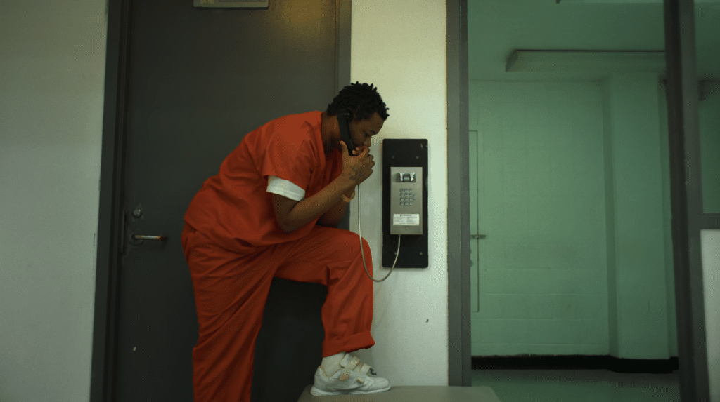 Santana's father on the phone with his family.