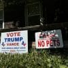 A Trump/Vance sign next to a 'No Pets' sign on a lawn.