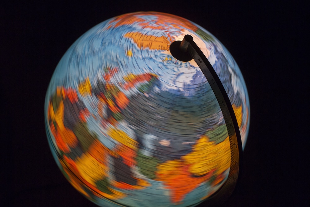 A spinning Earth globe. Global warming is changing the rate of Earth's rotation.