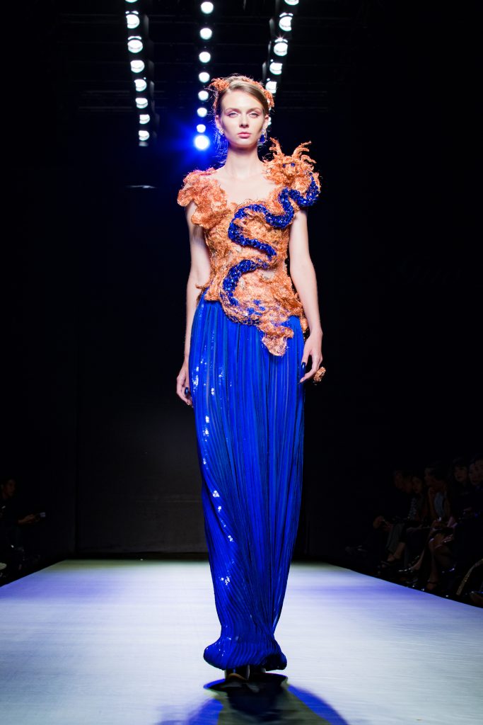 A model walks on the Fashion runway "Guo Pei" Haute Couture from China in "Bangkok International Fashion Week 2017." Credit: Shutterstock/RooftopStudioBangkok