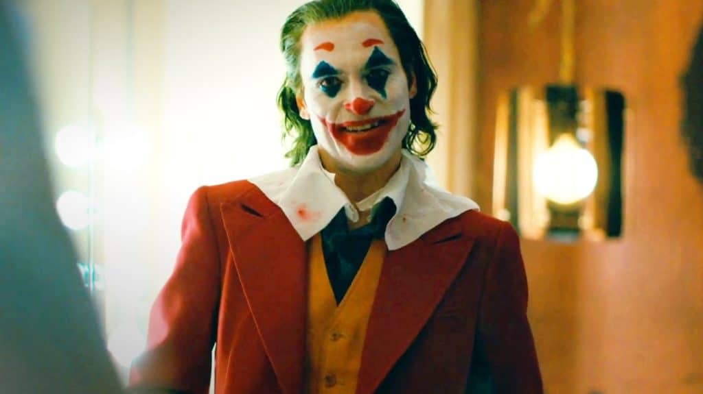 Arthur Fleck puts on a happy face in Joker. Credit: Warner Bros.