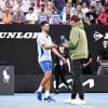 Nick Kyrgios and Novak Djokovic on a tennis court, Kyrgios is interviewing Djokovic