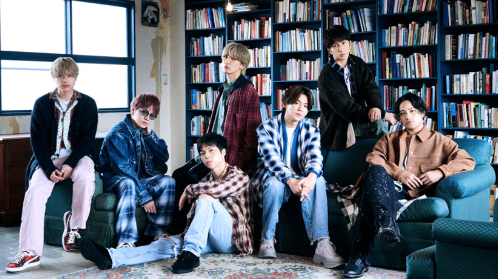 Five Japanese men standing in a library from left to right: Junta Nakama, Tomohiro Kamiyama, Ryusei Fujii, Daiki Shigeoka, Nozomu Kotaki, Takahiro Hamada, Akito Kiriyama