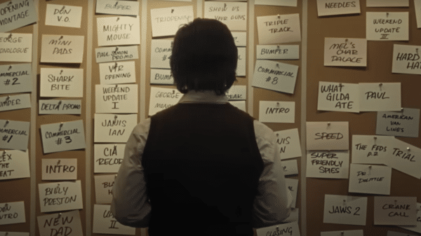 Lorne Michaels (Gabriel LaBelle) looks over the plans for Saturday Night. Credit: YouTube/Sony Pictures Entertainment