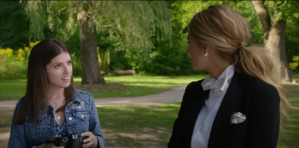 Still from A Simple Favor of Anna Kendricks character just having taken a picture of Blake Lively's character.