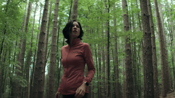 Iris (Kelsey Asbille) on the run in Don't Move (2024).