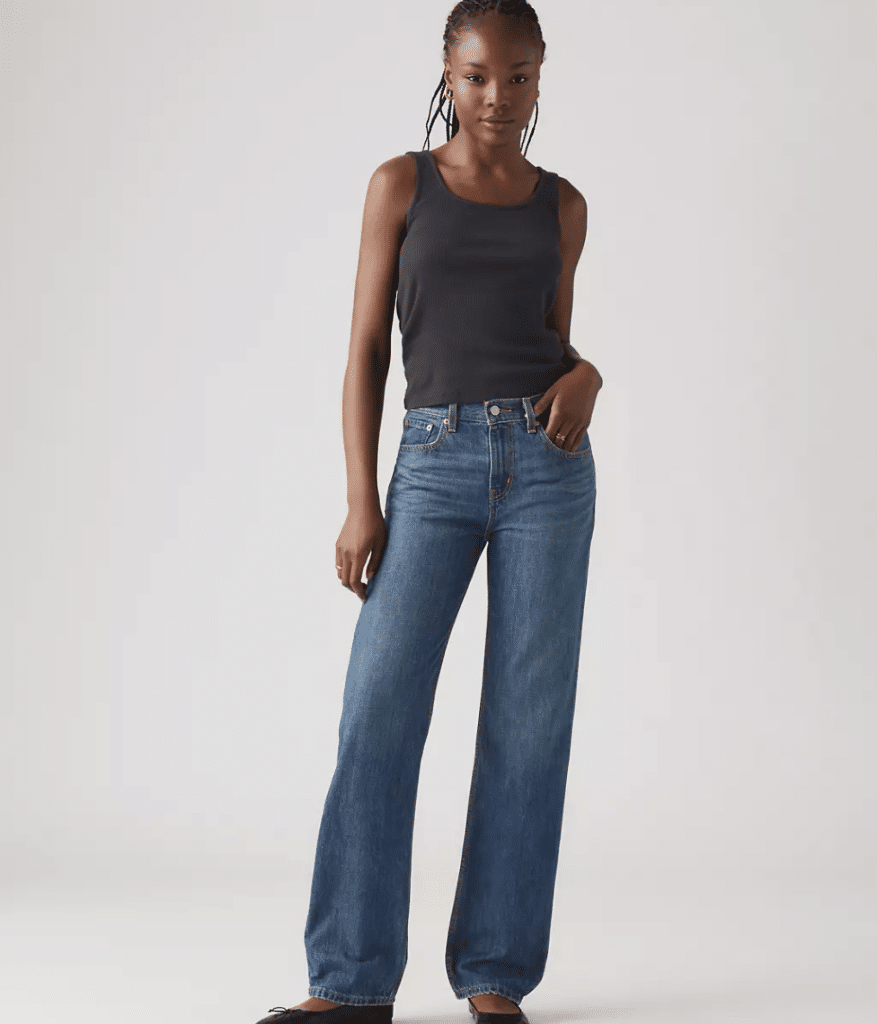 Model in a grey tank top and Low Pro Levi's
