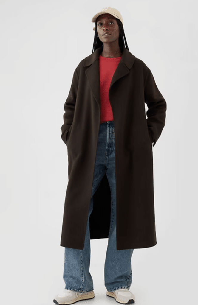 Model in a red top, jeans, and a dark Gap wool coat