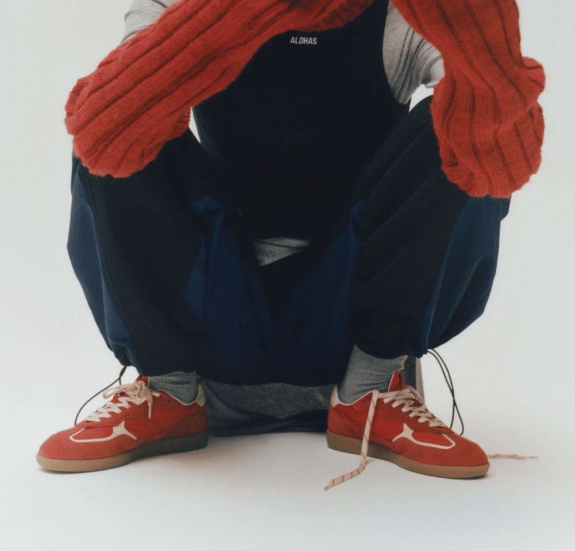 Dark Aloha's outfit with red leather sneakers