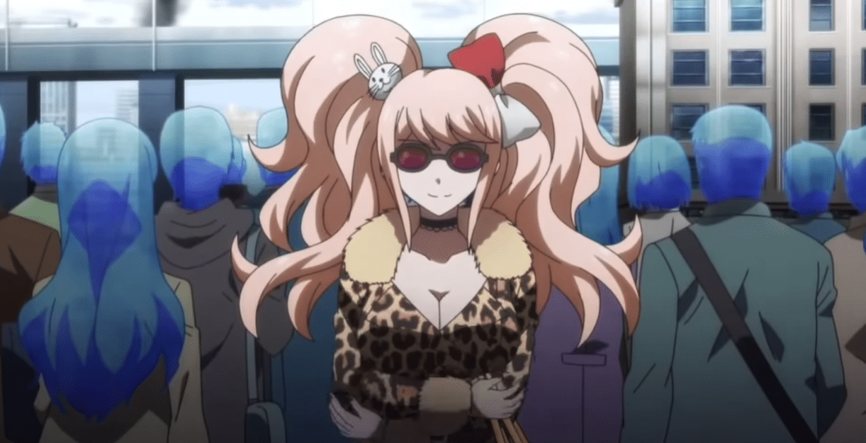 Junko Enoshima standing in sunglasses and a cheetah print dress