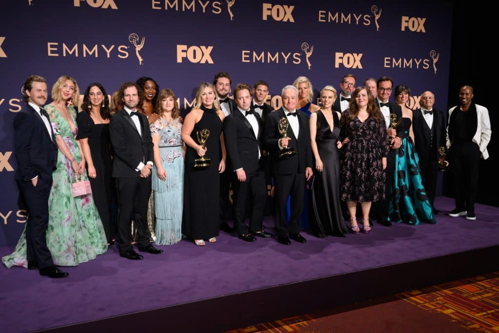 Lorne Michaels (center) with the 2019 cast of SNL at the Emmys. Credit: Shutterstock/Silvia Elizabeth Pangaro