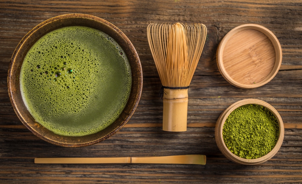 Matcha cup with whisk on a wood table
