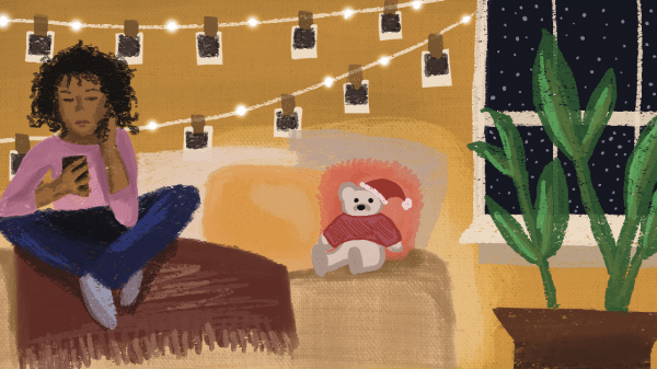 Illustration of a cozy room featuring a woman sitting cross-legged on a couch while looking at her phone. The room is warmly lit with string lights and hanging Polaroid photos on the wall. A small stuffed bear wearing a Santa hat and sweater sits on a cushion beside her. A large potted plant is placed near a window showing a nighttime scene with falling snow.