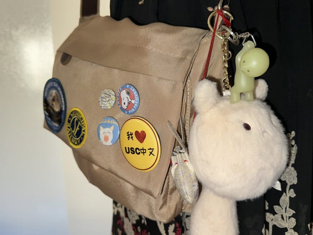 A student showing off her Jane-Birkin inspired bag charms