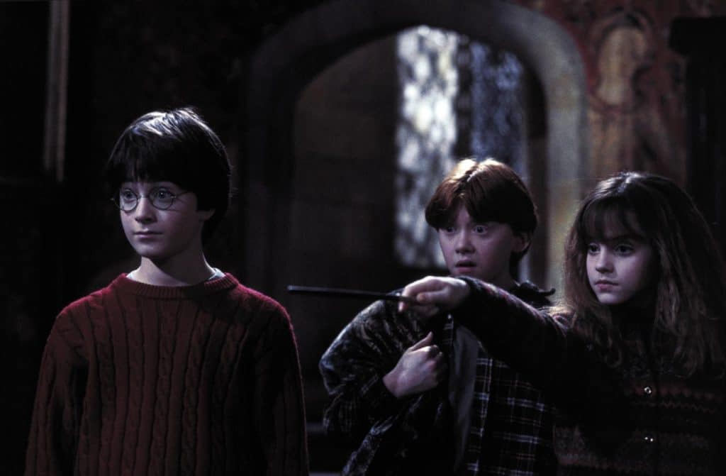 Harry (played by Daniel Radcliffe) with Ron (Rupert Grint) and Hermione (Emma Watson).