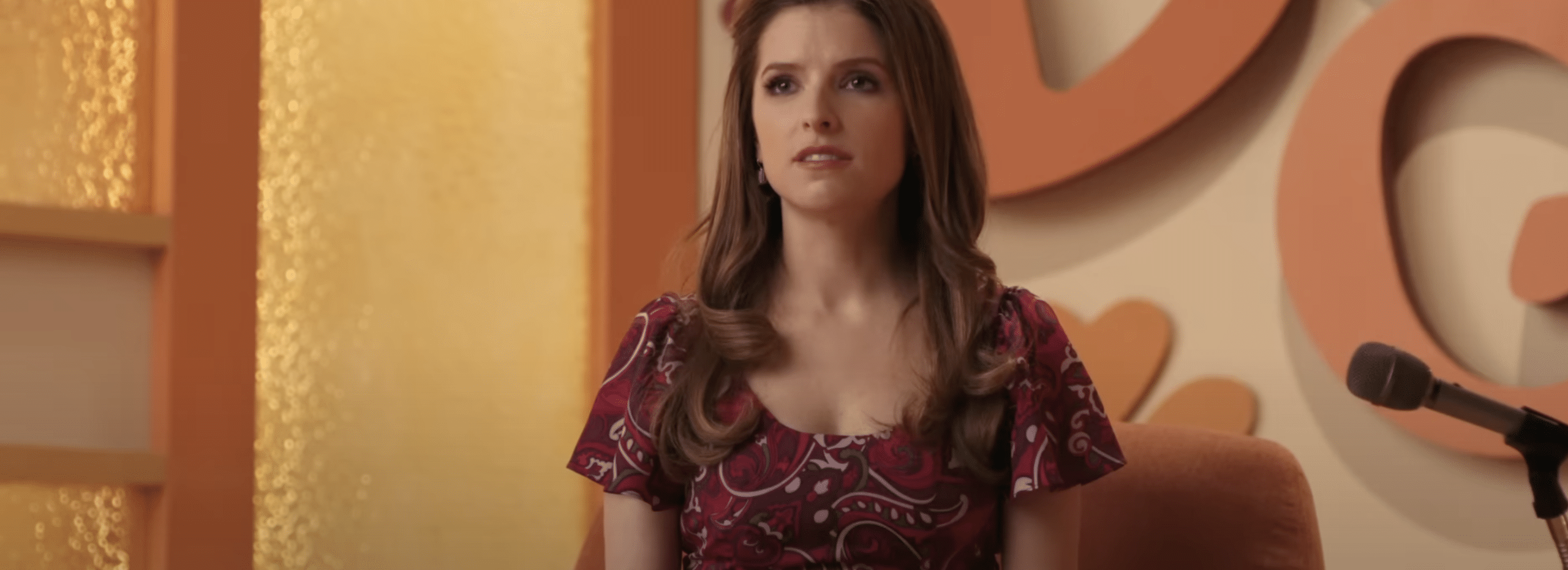 Anna Kendrick sitting in Woman of the Hour