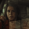 Karla Sofía Gascón as the titular Emilia Pérez, thinking in a car. Credit: Netflix