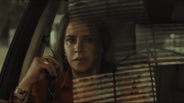 Karla Sofía Gascón as the titular Emilia Pérez, thinking in a car. Credit: Netflix