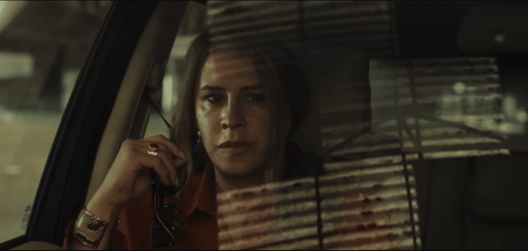 Karla Sofía Gascón as the titular Emilia Pérez, thinking in a car. Credit: Netflix