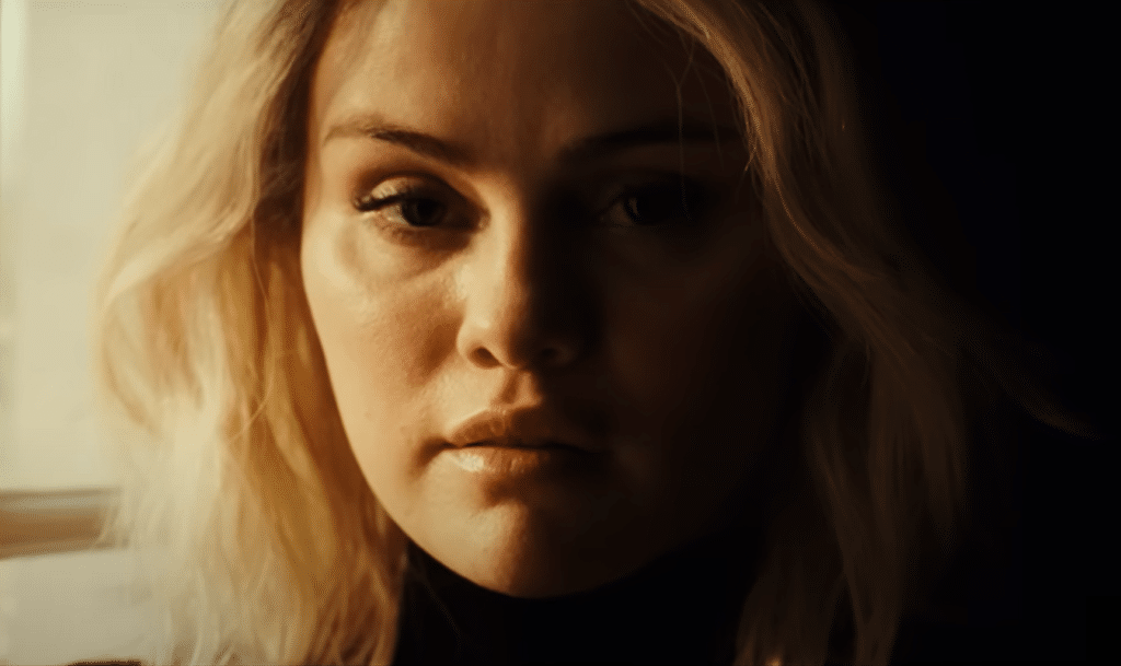 A half-silhouetted Selena Gomez as Jessi in Emilia Perez (2024). Credit: Netflix
