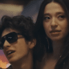 Ani, played by Mikey Madison, being held by Vanya Zakharov, played by Mark Eydelshteyn, in a casino.