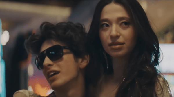 Ani, played by Mikey Madison, being held by Vanya Zakharov, played by Mark Eydelshteyn, in a casino.