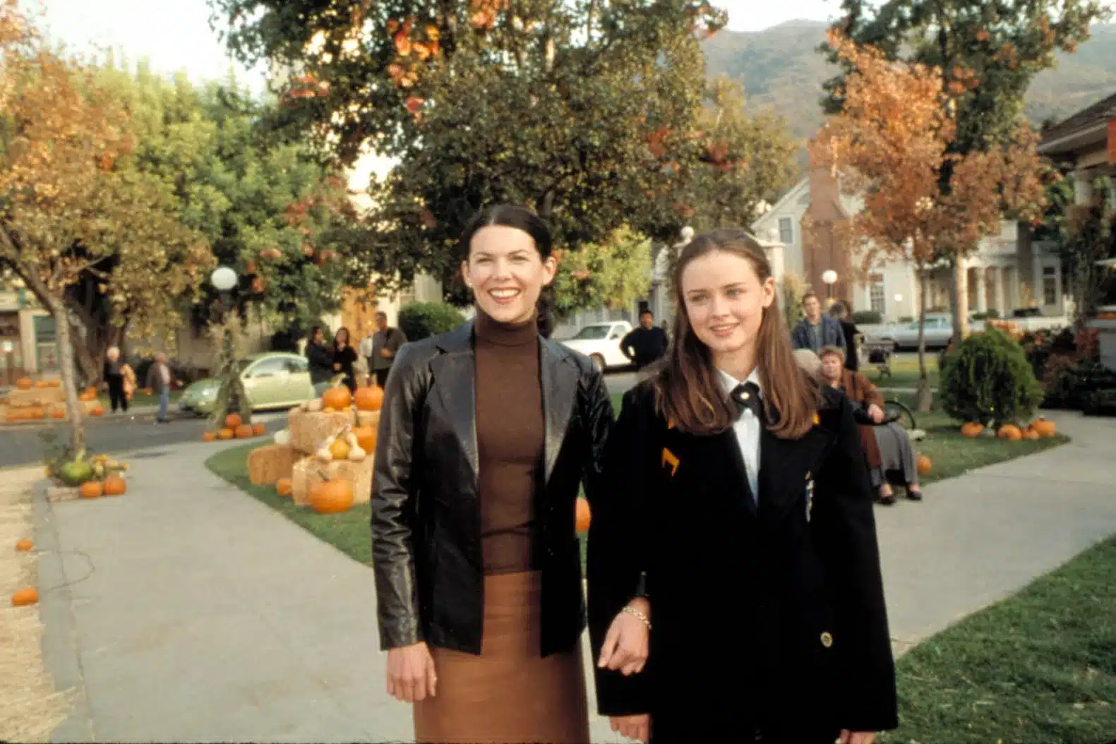 Lorelai and Rory Gilmore from Gilmore Girls in cozy Stars Hollow