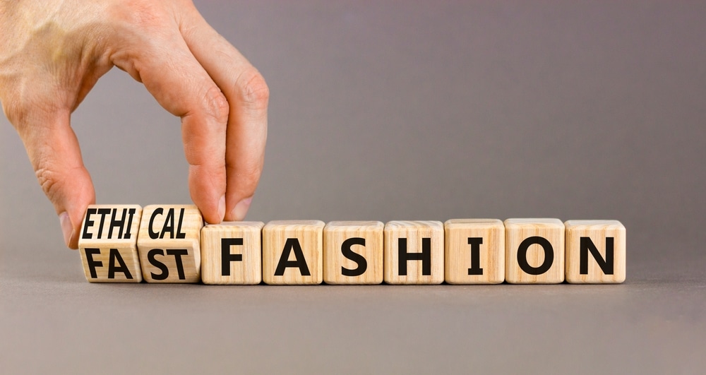 Letters on wooden cubes switching from "fast fashion" to "ethical fashion."